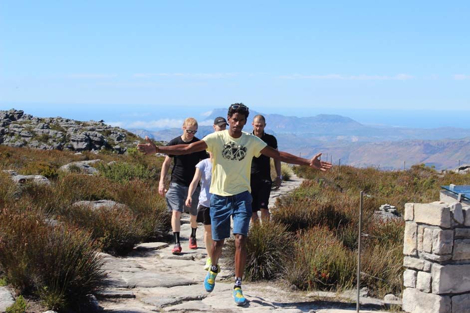 King of the mountain: Daniel Teklehaimanot celebrates reaching the summit