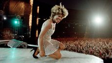 Tina Turner on stage during her concert at Wembley Stadium in London, England, as part of her Wildest Dreams World Tour, 20th July 1996. Commencing in the spring of 1996 The Wildest Dreams Tour would last for 16 months, and included more than 250 concert dates in Europe, North America and Australasia