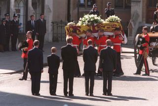 Princess Diana's coffin is in front of Prince Charles, Prince Harry, Earl Charles Spencer, Prince William, and Prince Philip on the day of her funeral, September 6, 1997