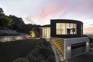 View at dusk of Round House by Feldman architecture