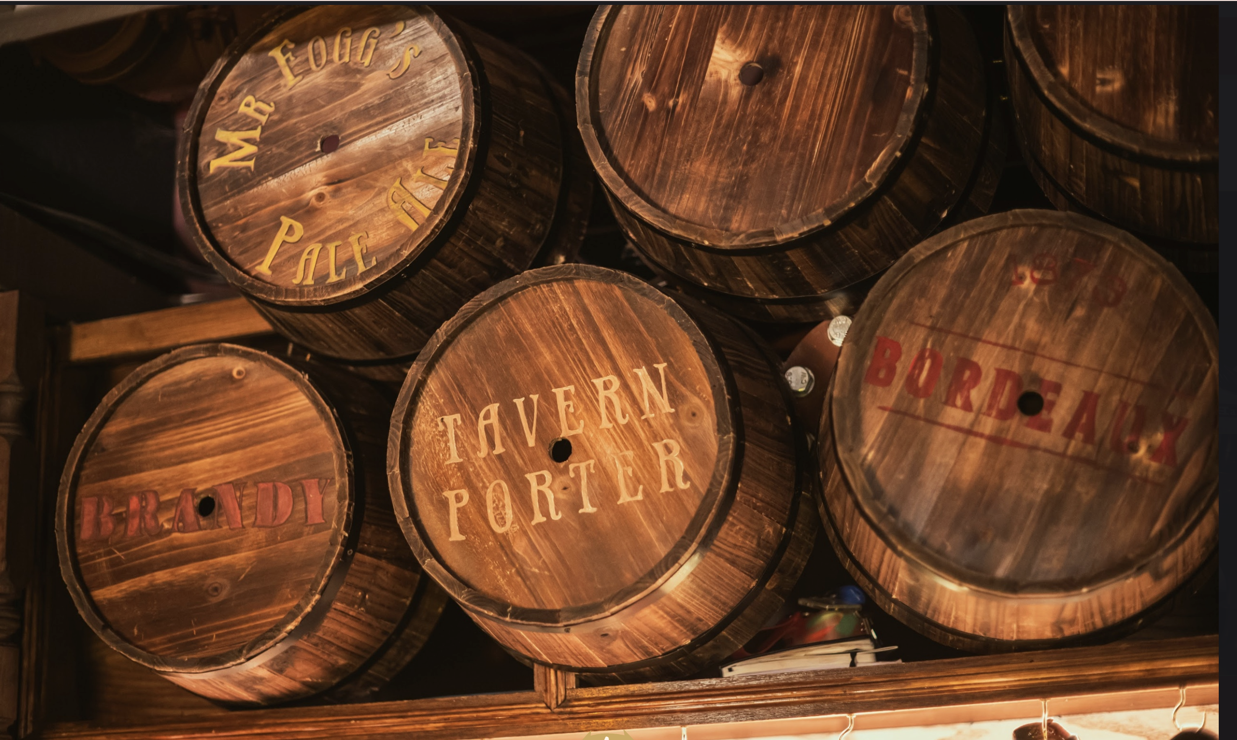 an image of five wooden barrels stacked one on the other