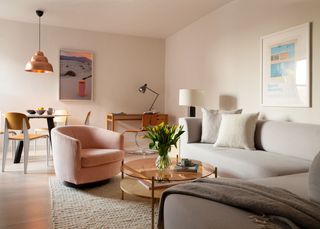 Pink and grey living room designed by White Arrow