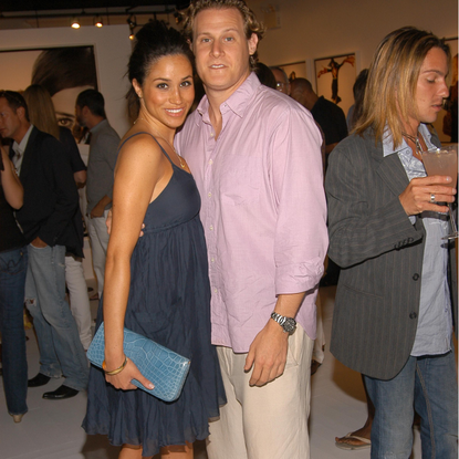 Meghan Markle and Trevor Engelson attend COACH Legacy Photo Exhibit by REED KRAKOFF at Coach on August 26, 2006 in East Hampton, NY. 