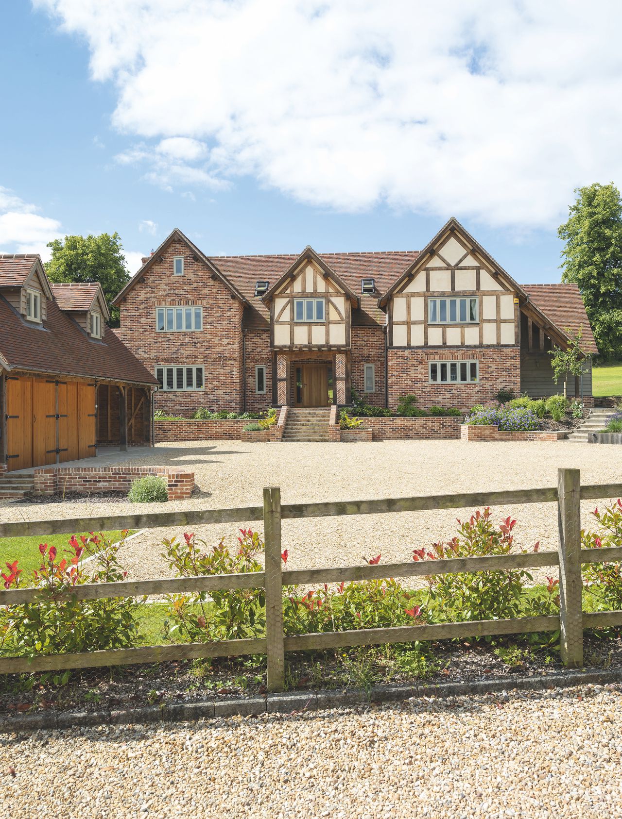 brick and rendered traditional house with gravel driveway