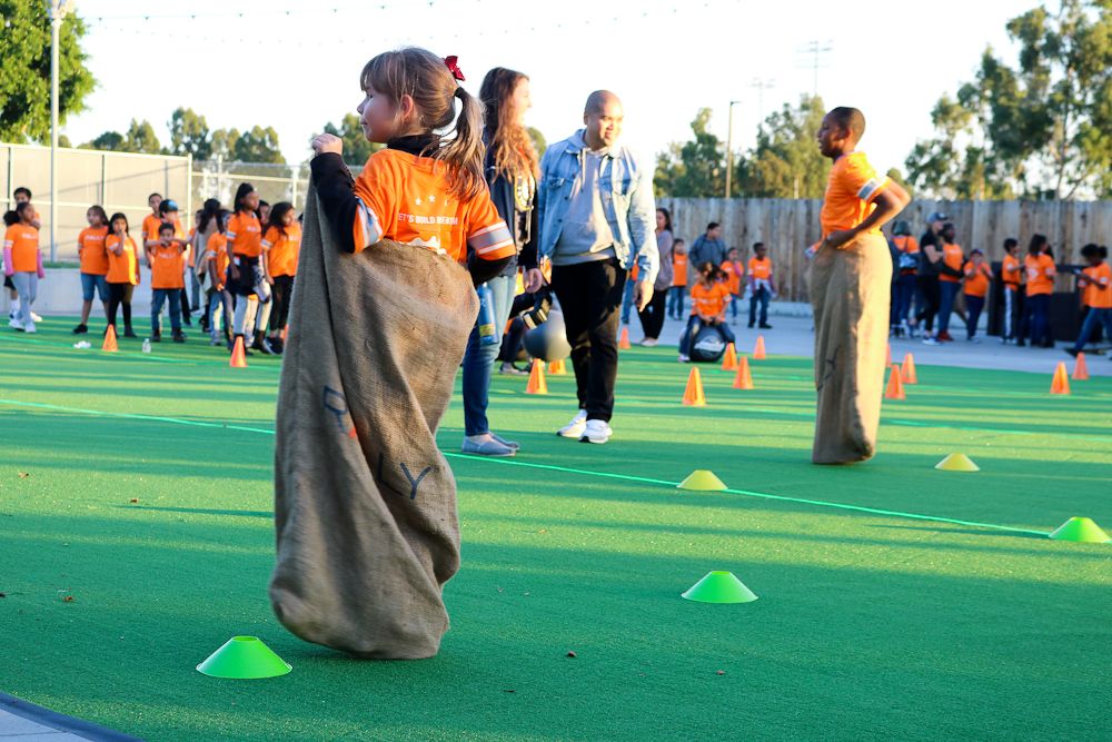 One of the bike recipients takes part in the sack race