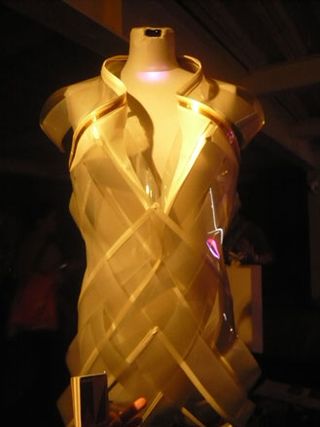 A dress on a mannequin, made out of smart e-foils that turns opaque on close contact