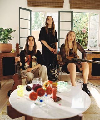 Haim in their recording studio with Etsy collection