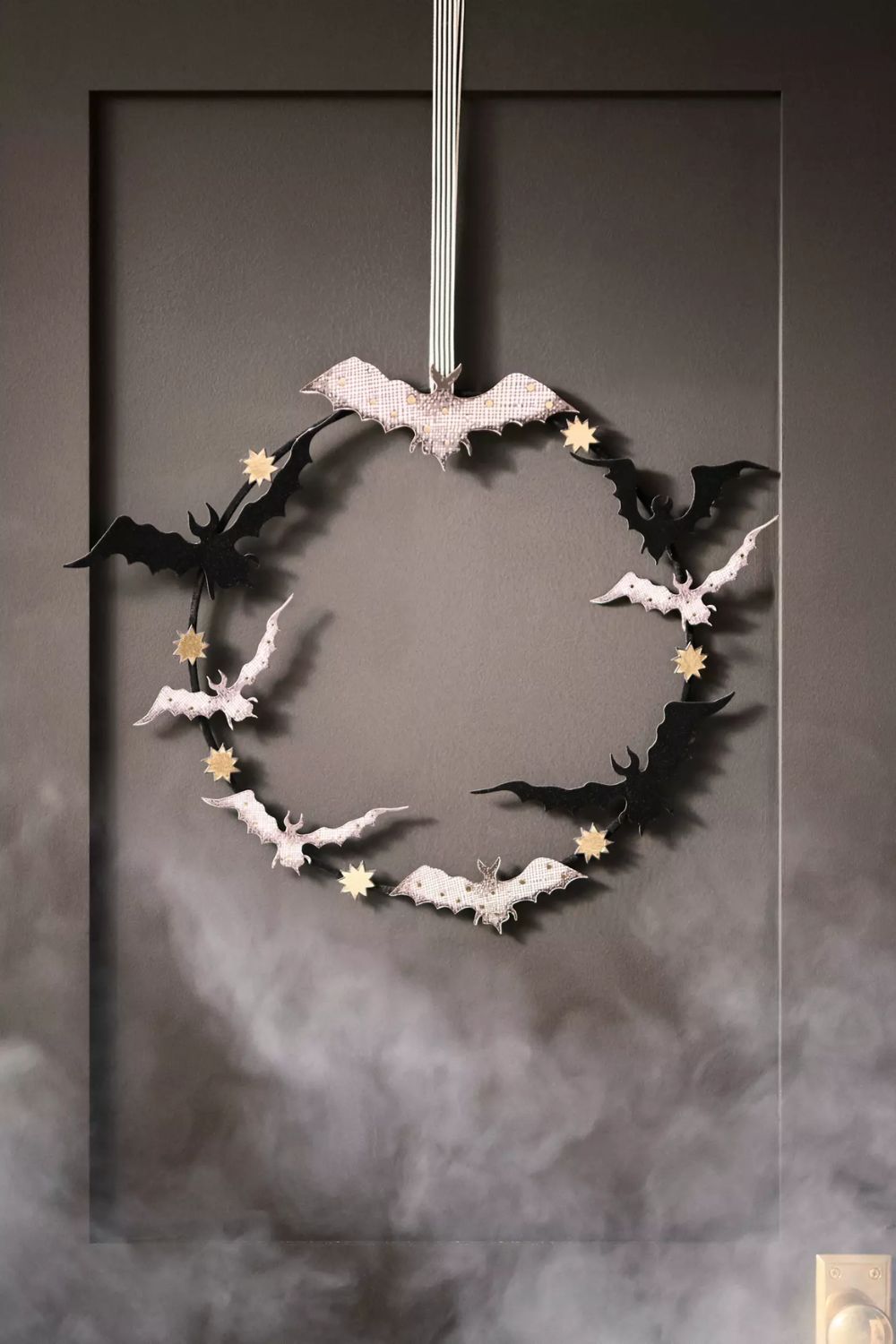 Black and white bat wreath with gold star accents