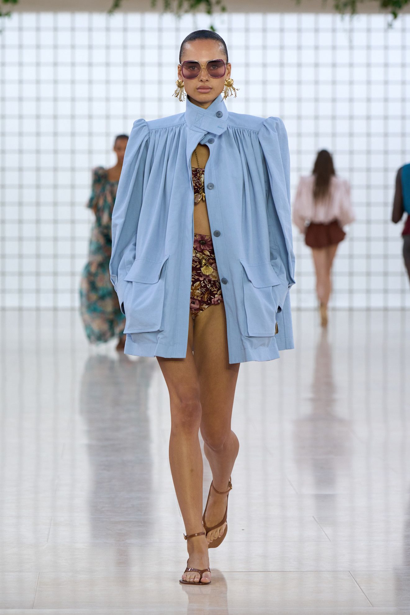 Model wears the baby blue color trend on the runway.