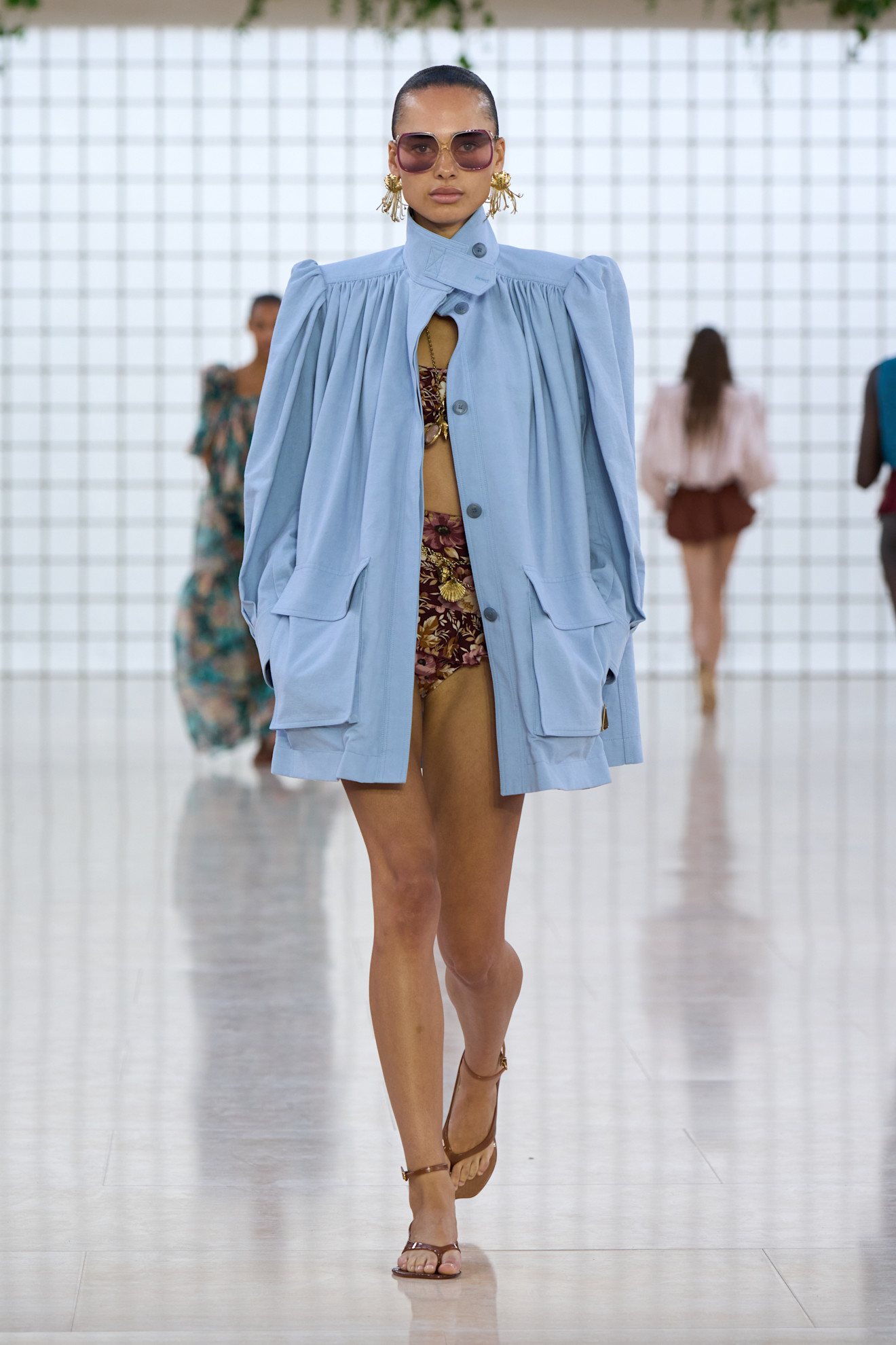 Model wears the baby blue color trend on the runway.
