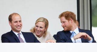 Prince William, Duke of Cambridge, Zara Phillips and Prince Harry watch a carnival parade as they attend 'The Patron's Lunch' celebrations
