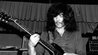 Tony Iommi performing onstage with Black Sabbath in the late 1960s