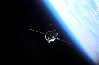 The Soyuz TMA-9 capsule carrying space tourist Anousheh Ansari is seen with Earth and space in the backdrop.