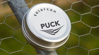 solarcan puck attached to a fence