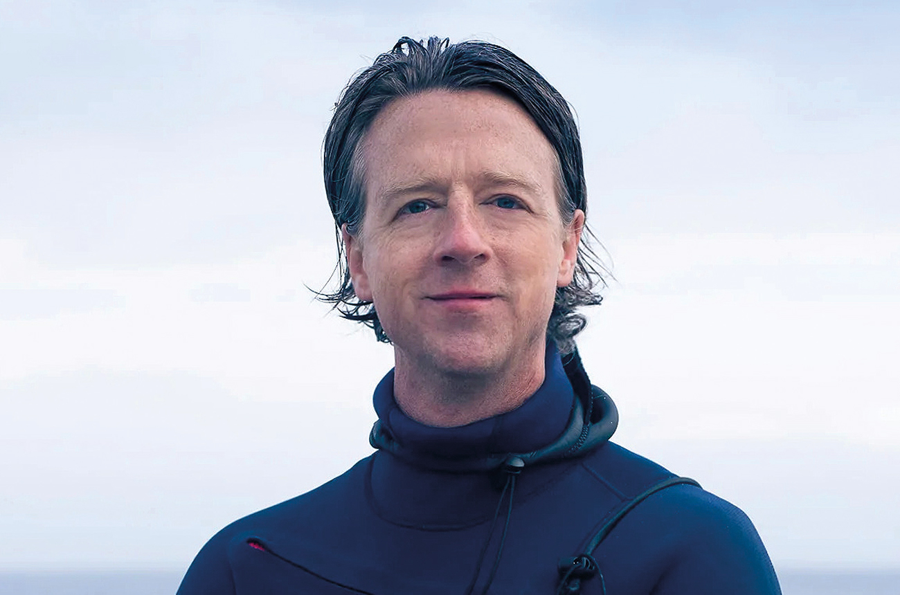 A man standing by the sea