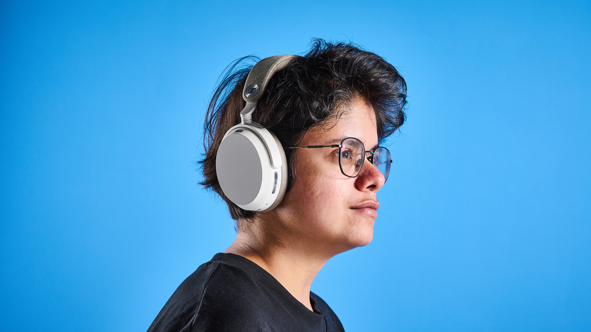 the sennheiser momentum 5 in white photographed against the blue tom's guide background