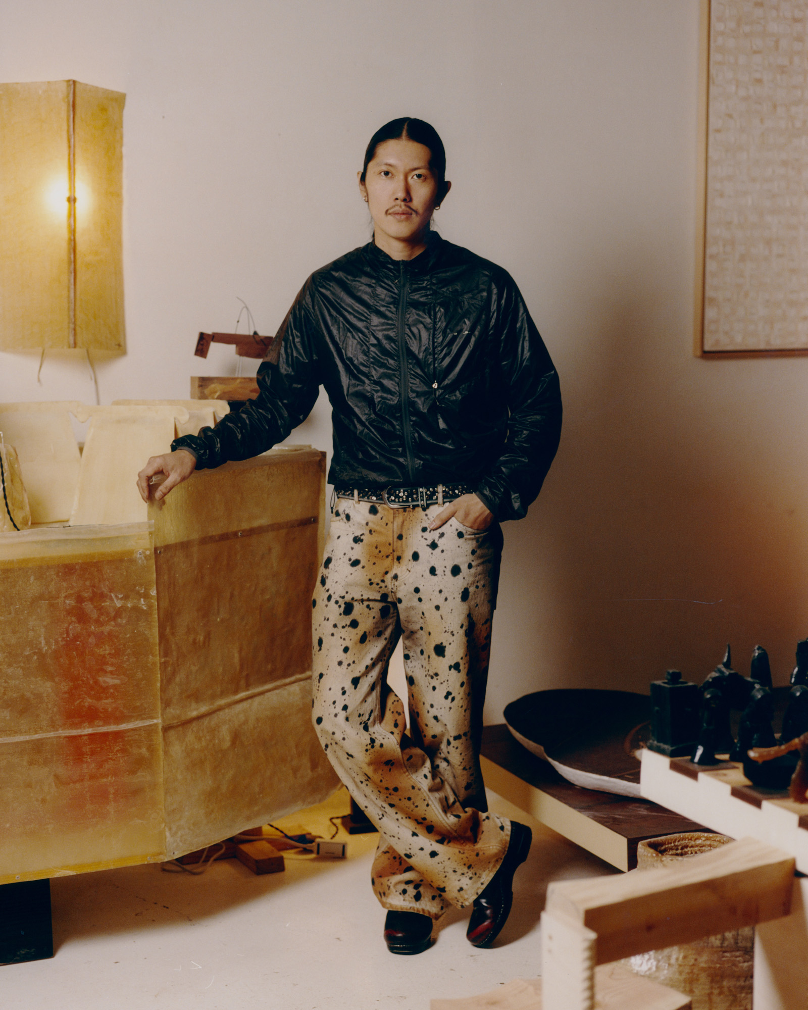 Designer Minjae Kim with some of his work