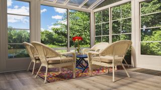 Bright conservatory with sun room ideas incorporated plus wooden furniture overlooking green garden views