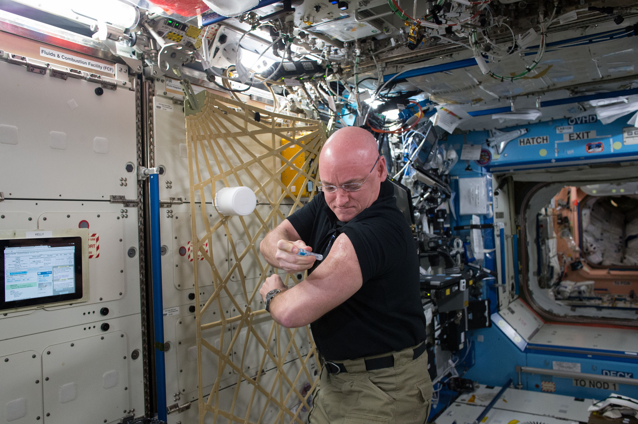 Scott Kelly gives flu shot