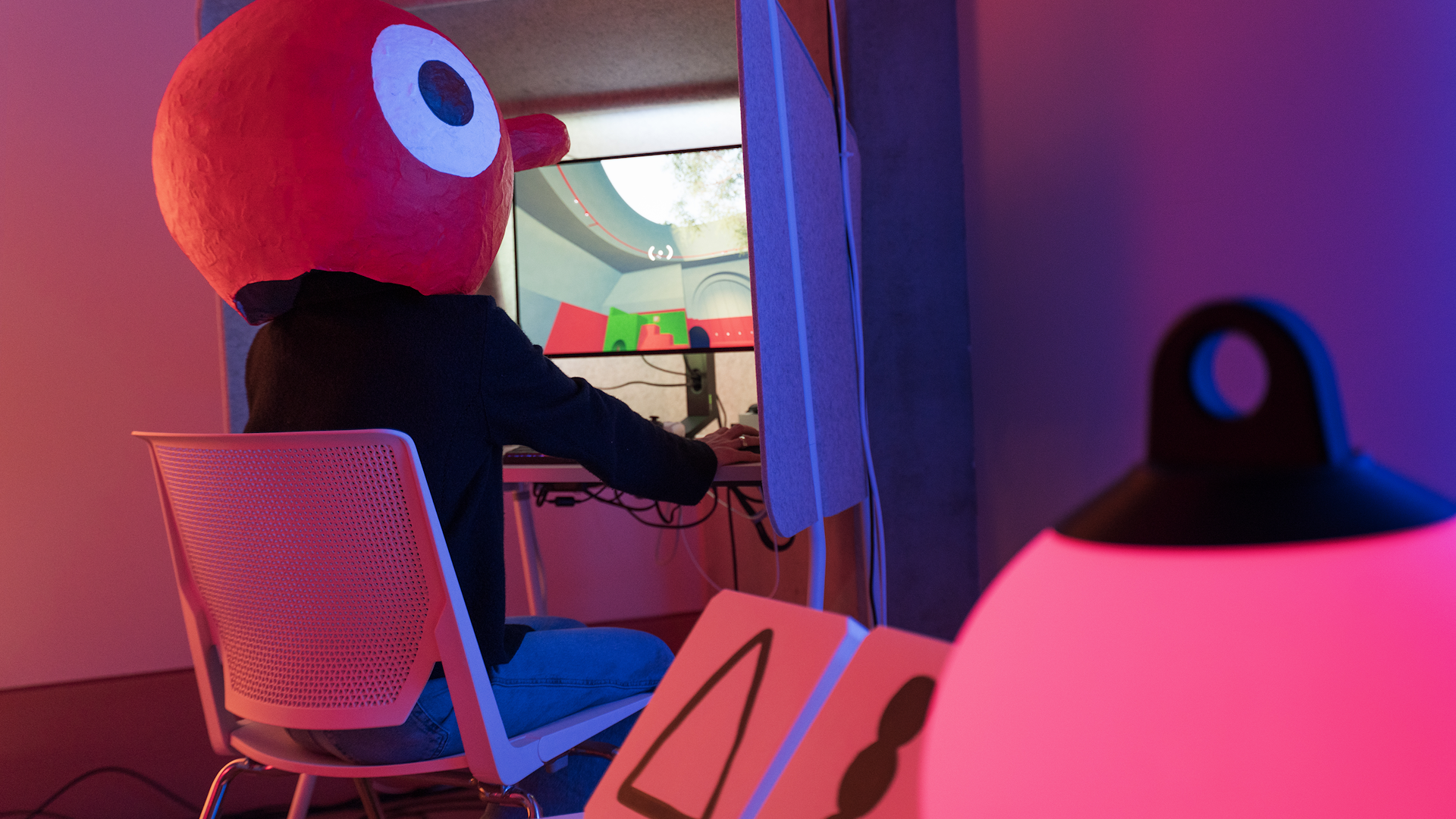 Photo of the Big Walk preview room at Panic HQ featuring someone playing in one of the pods