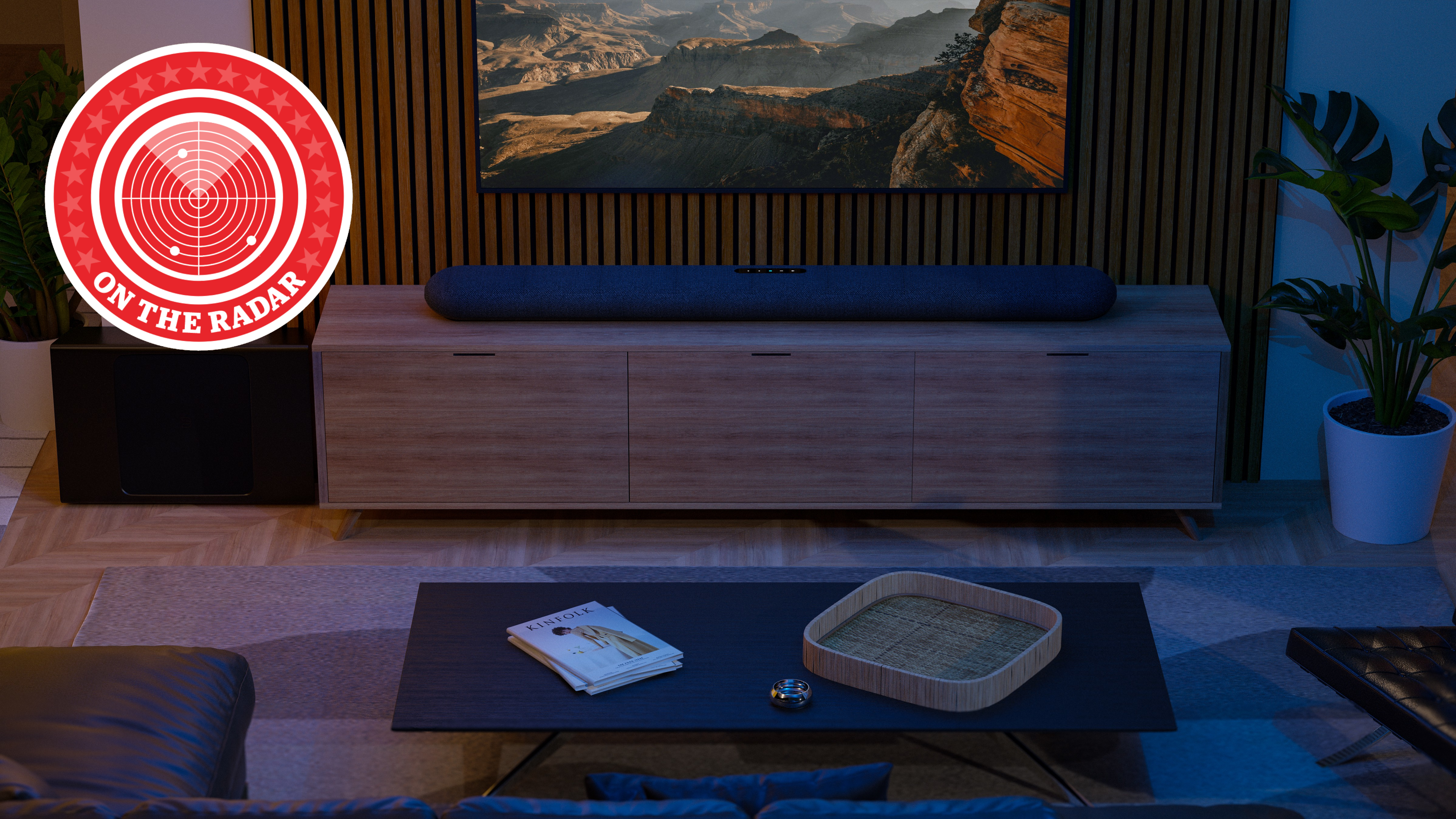 Bluesound pulse cinema soundbar in a modern living room sitting on a wooden media unit. A logo in the top left reads "on the radar"