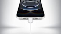 Close up of the USB Type-C charging port on the iPhone 16e in front of a gray background