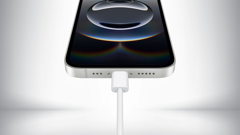 Close up of the USB Type-C charging port on the iPhone 16e in front of a gray background