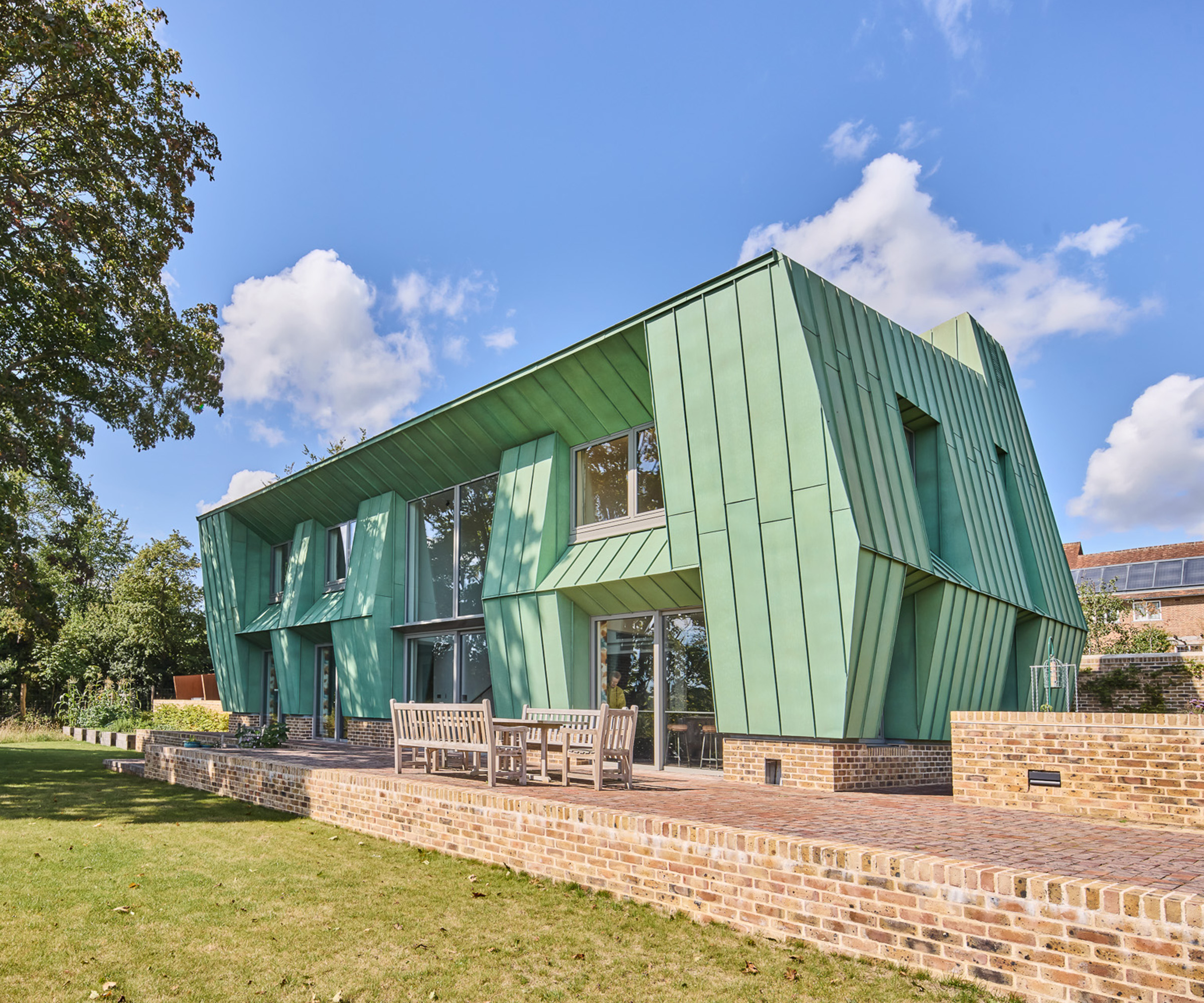 Exterior view of a copper clad self build project with angled walls