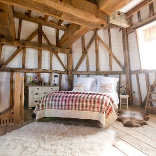 windmill with bedroom and wooden floor and rug
