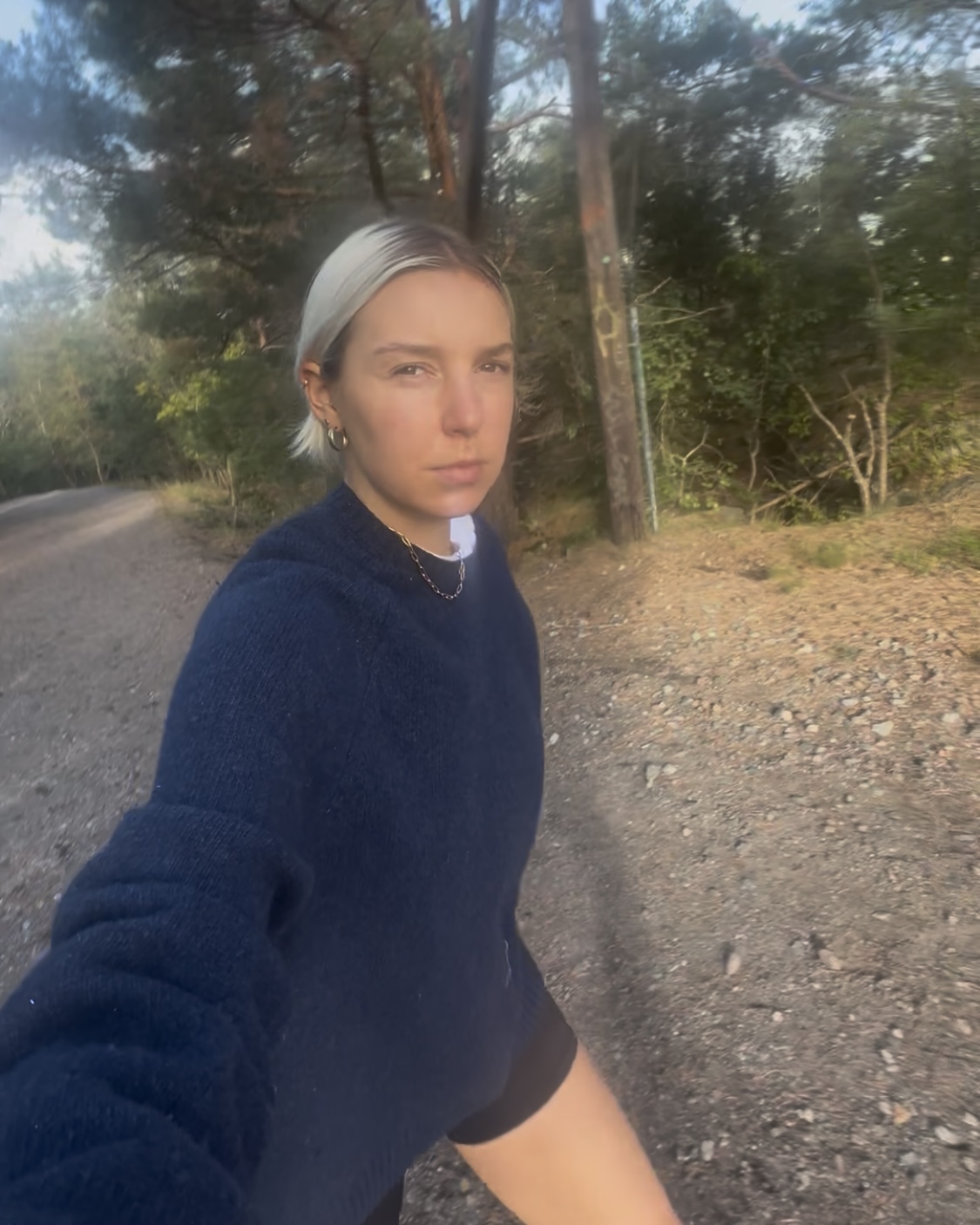 A woman hiking on a forest trail