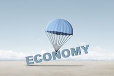 soft landing concept shown word economy tied to a parachute slowly falling to the ground