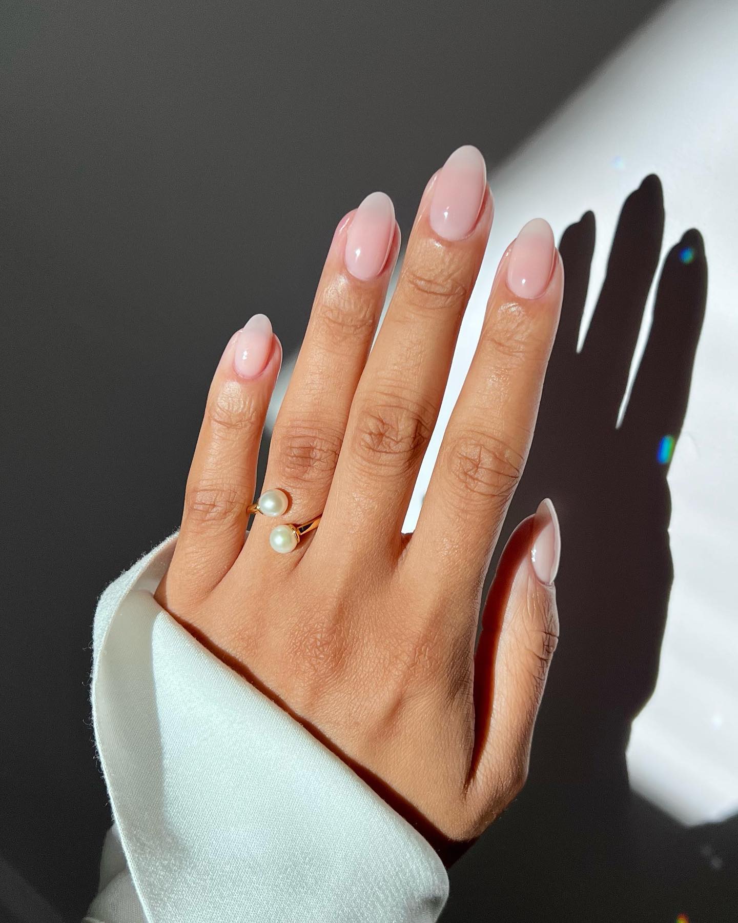 Iram Shelton wearing Essie Allure Nail Polish