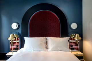 A grand curved bed at the Henrietta Hotel London