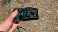 The GoPro Mission 1 Pro with the point-and-shoot grip at a splash park