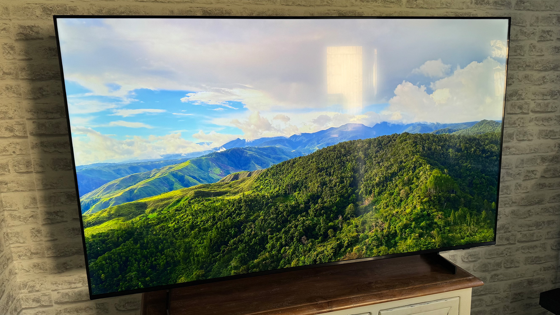 Samsung UE65U8000F 65-inch TV, on screen is aerial view of hills and mountains