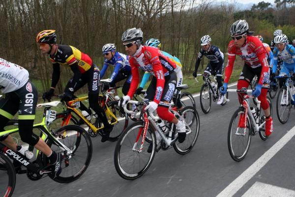 Stefano Garzelli (Aqua &amp; Sapone) rides alongside Tom Boonen (Quick Step) in the peloton