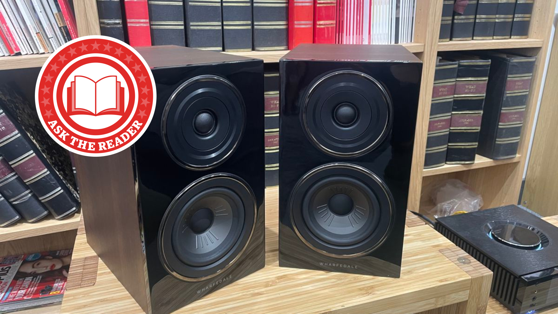 Wharfdale speakers on stand with Ask The Reader logo