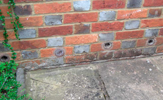 Wall injected with damp treatment