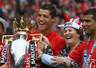 Cristiano Ronaldo celebrates with the Premier League trophy alongside his mother Dolores after the Red Devills' title triumph in May 2009.