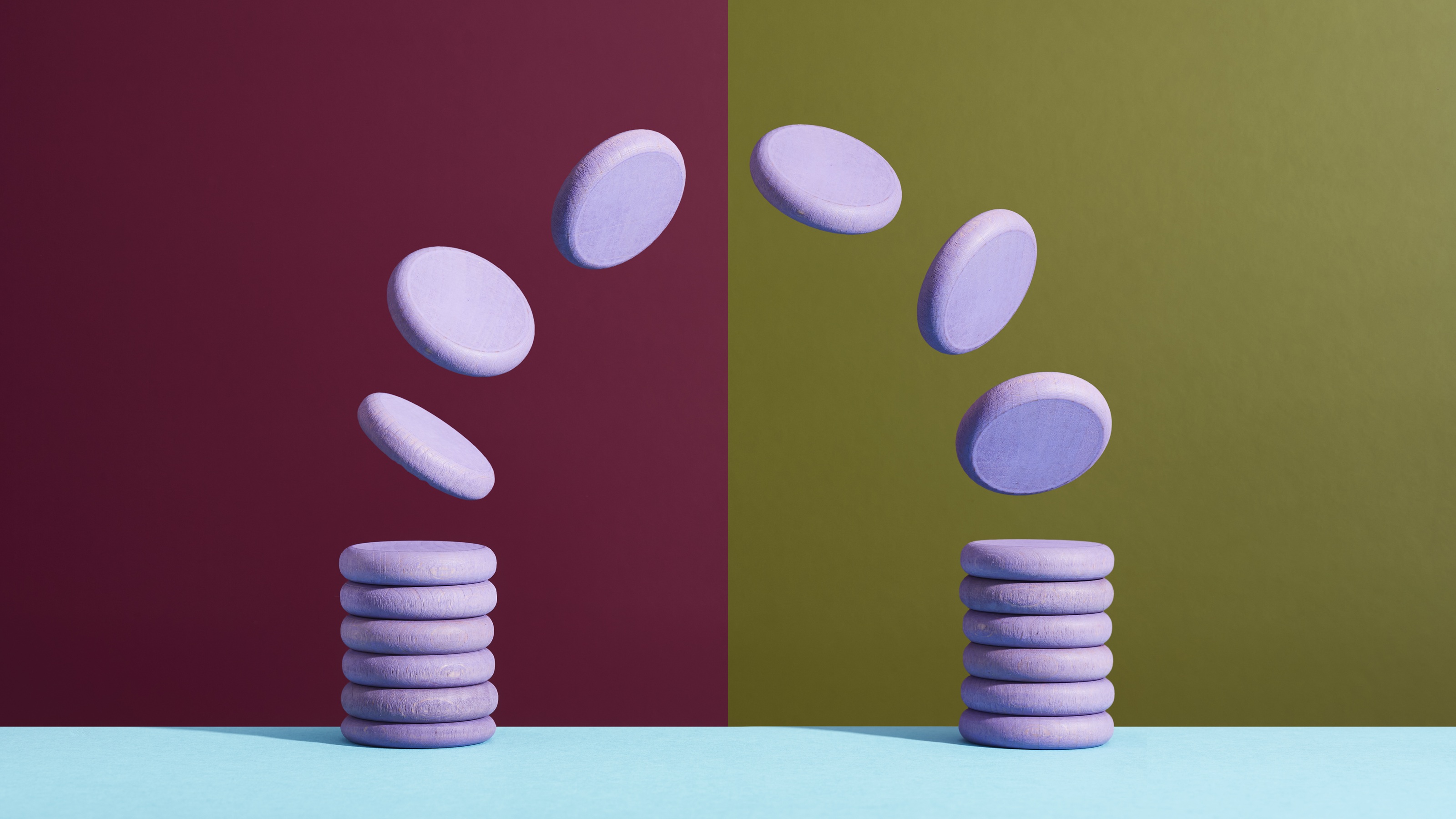 Purple disks representing coins fly from one stack to another.