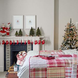 Bedroom with fireplace decorated for Christmas with calendar stockings