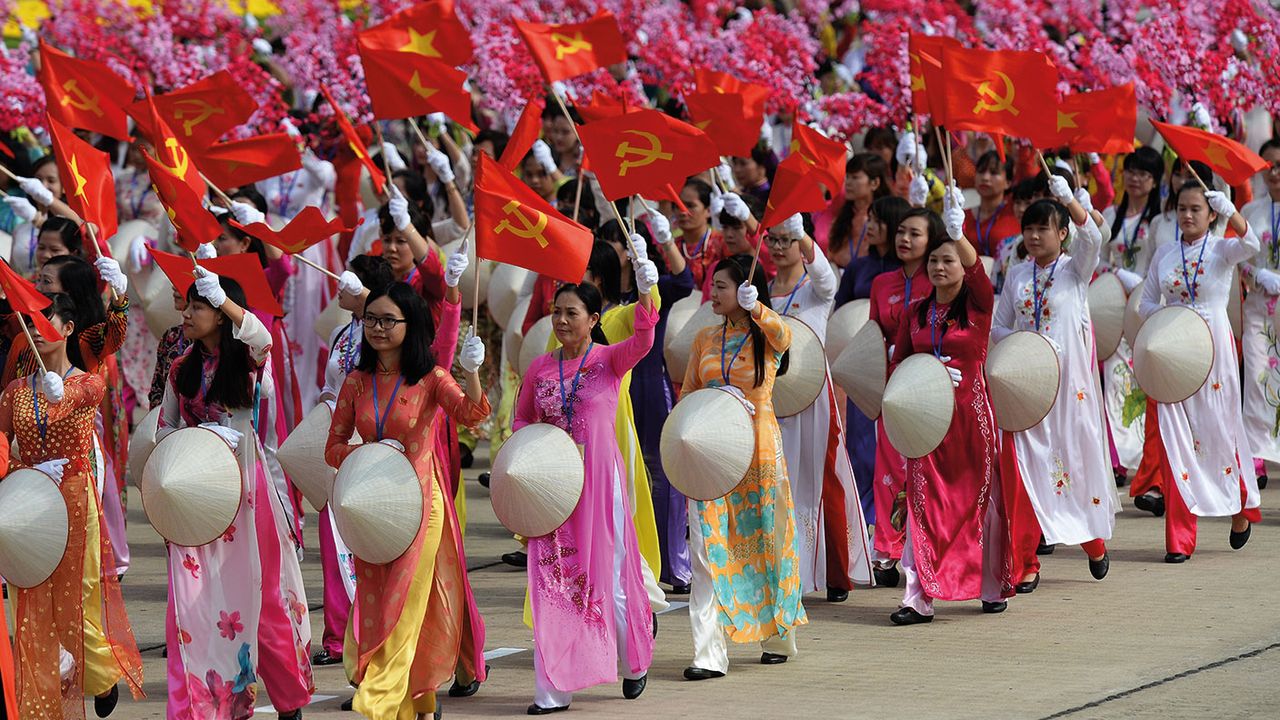 Women in traditional &amp;quot;ao dai&amp;quot; dress parading in Vietnam © HOANG DINH NAM/AFP via Getty Images