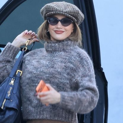 Jennifer Lopez elevated a brown pair of leggings with a cropped sweater, a newsboy cap, and her favorite Dior D-Journey bag