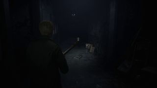 Leon exploring Toluca Prison in the Silent Hill 2 remake