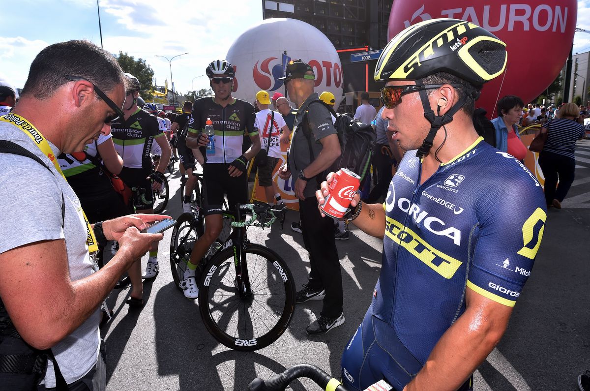 Caleb Ewan takes a drink after his second place finish