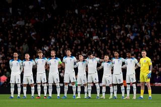 England players link arms as a minute's silence is held for the victims of the war in Isreal and the victims of the Brussels terrorist attack, prior to kick off in the UEFA EURO 2024 European qualifier match between England and Italy at Wembley Stadium on October 17, 2023 in London, England. (Photo by Jonathan Moscrop/Getty Images)
