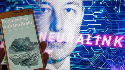 hand holds up phone with the Neuralink website displayed on its screen. In the background, an edited photo of Elon Musk's face with the word "Neuralink" superimposed over it can be seen