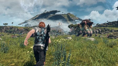 The protagonist runs across an open meadow in Xenoblade Chronicles X. Large fauna and towering mountains can be seen in the distance.