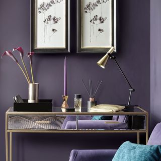 study table with beat lamp and purple candle