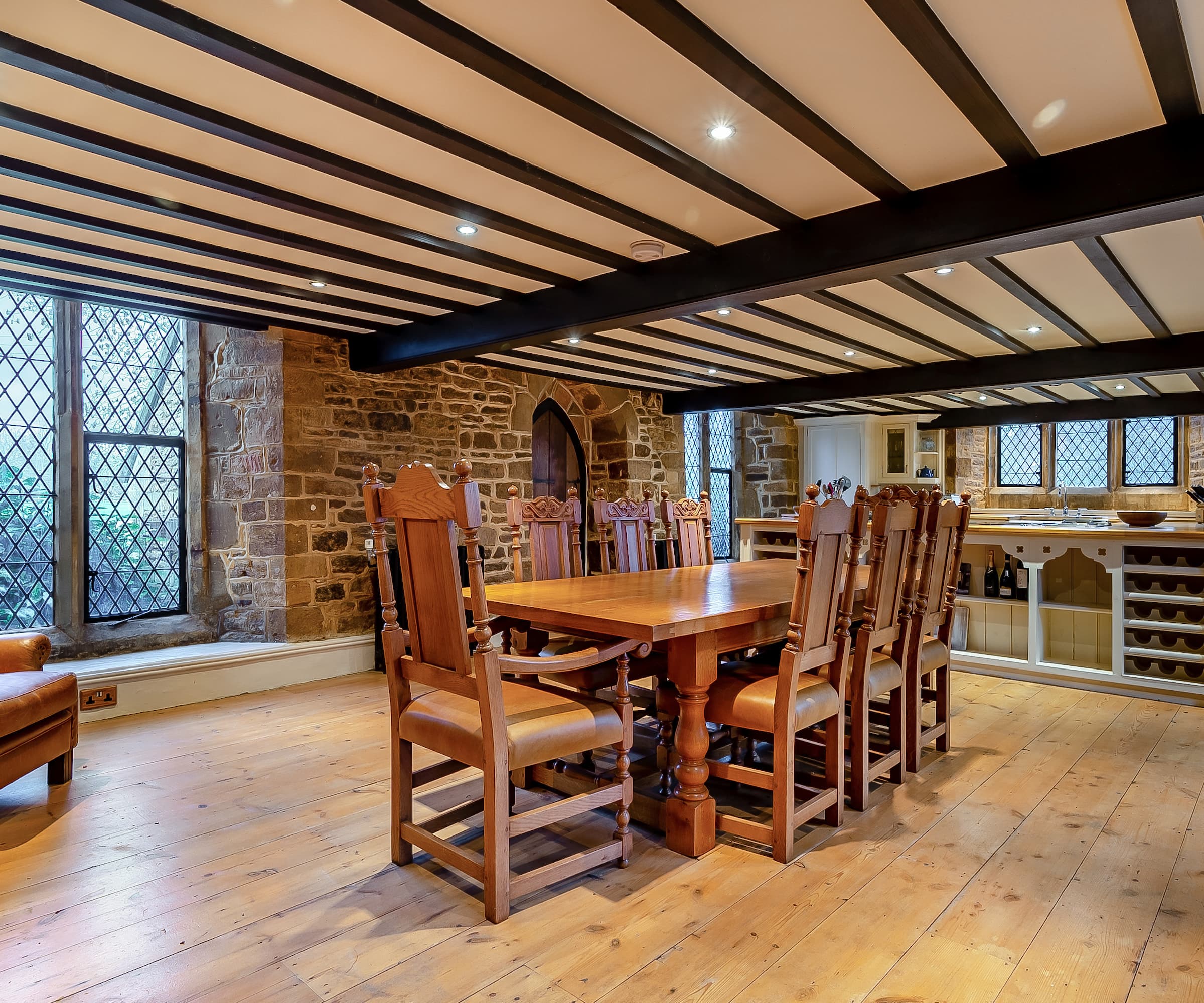 A kitchen-diner with a large wooden dining table